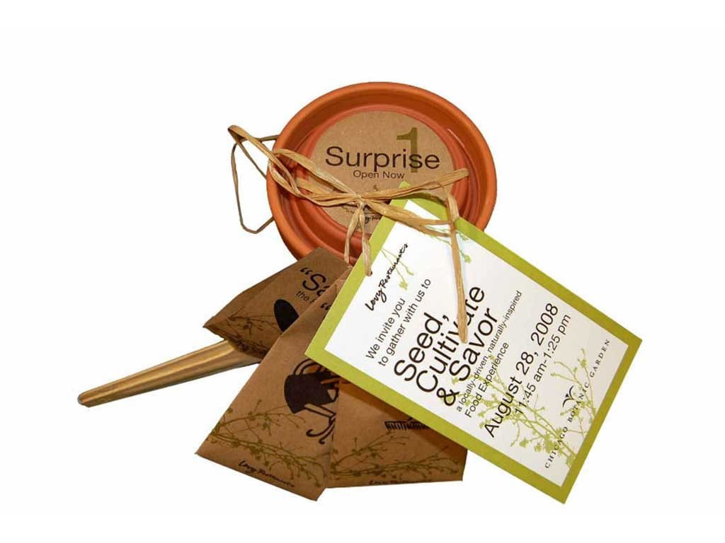 Seed packet invitation with a terracotta pot and tag reading Seed, Cultivate and Savor