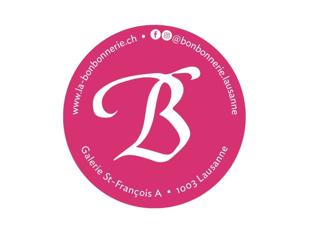 Round pink La Bonbonnerie sticker with the shop's web and social details
