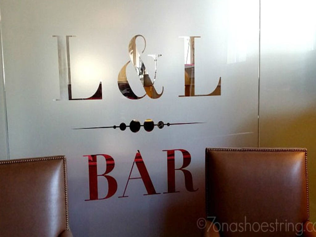 L and L Bar logo etched on frosted glass